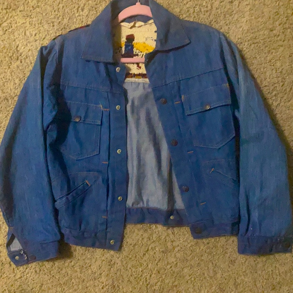 Vintage Jean Jacket with Native American embroidered back.
